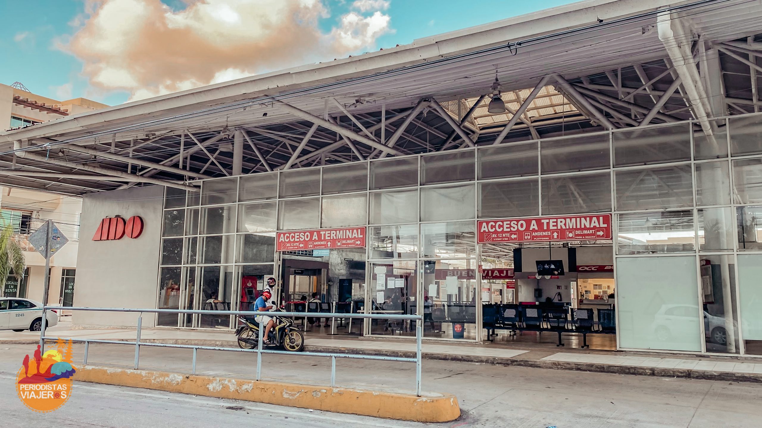 The ADO bus terminal entrance in Playa del Carmen with 'Acceso a Terminal' signage