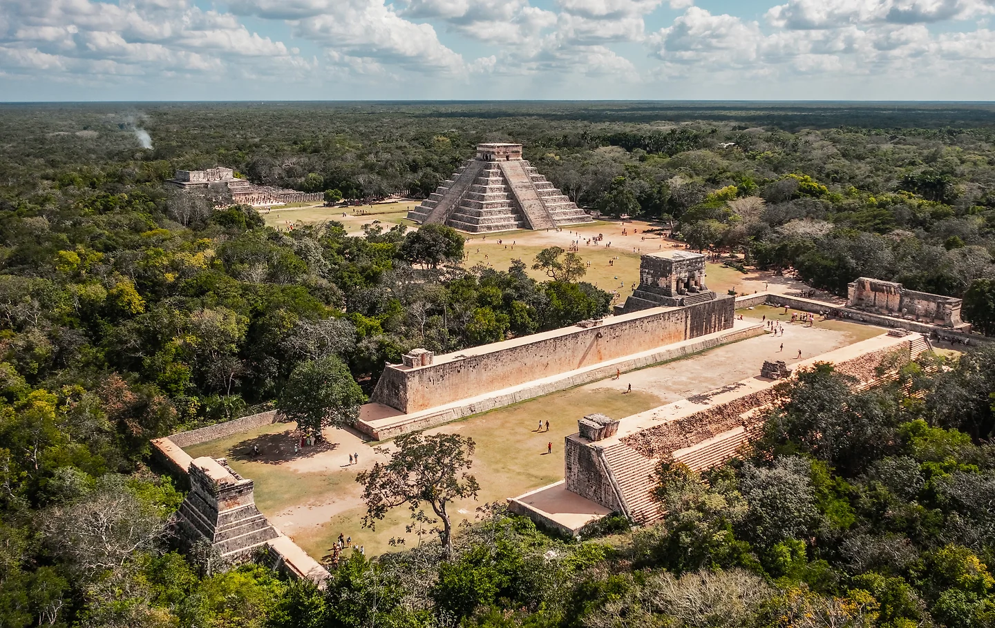 Aerial view of the pyramid of Kukulcán and the ball court at Chichén Itzá surrounded by jungle