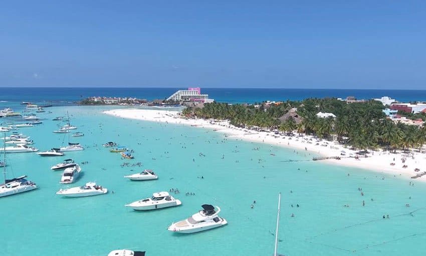 Aerial of Playa Norte, Isla Mujeres, with boats on turquoise water