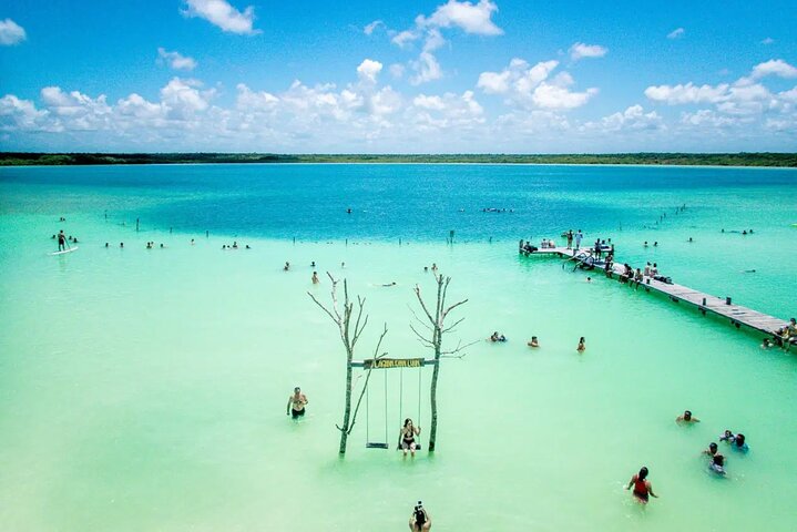 The turquoise water and central deep cenote of Laguna Kaan Luum near Tulum