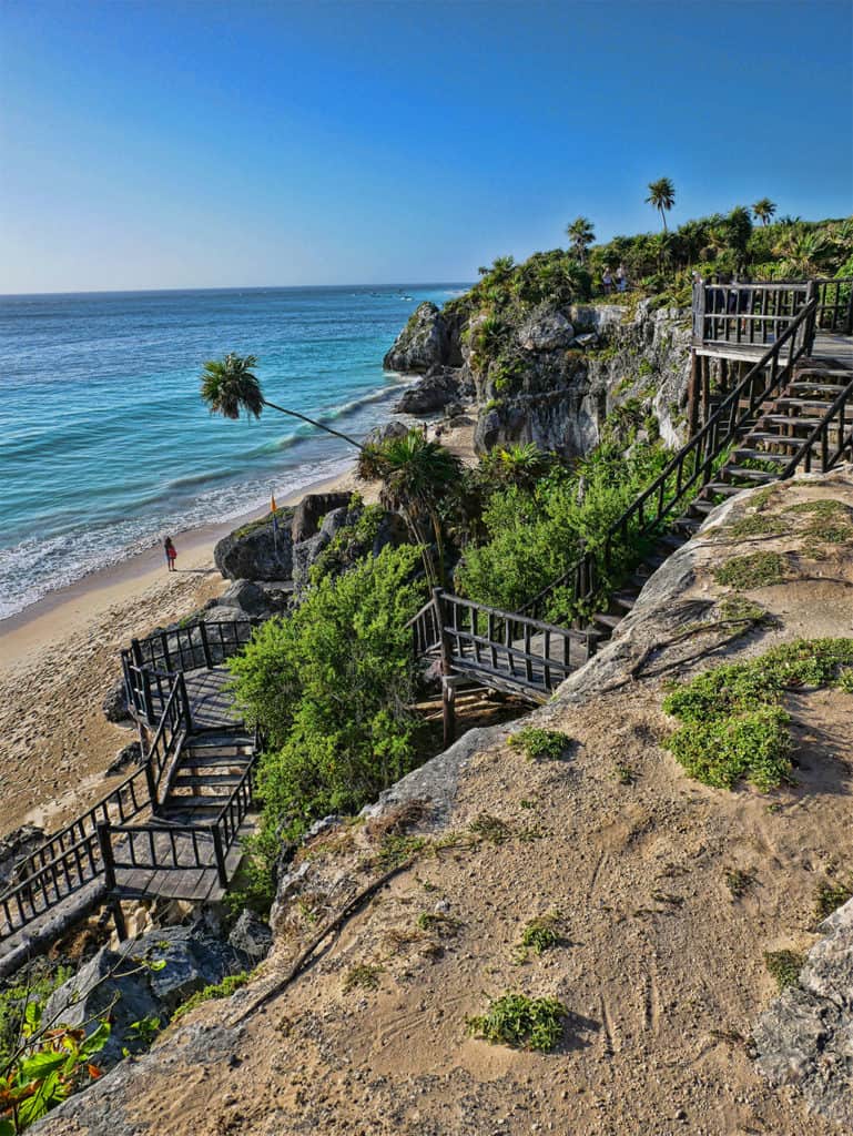 Wooden staircase down to the beach below the Tulum ruins